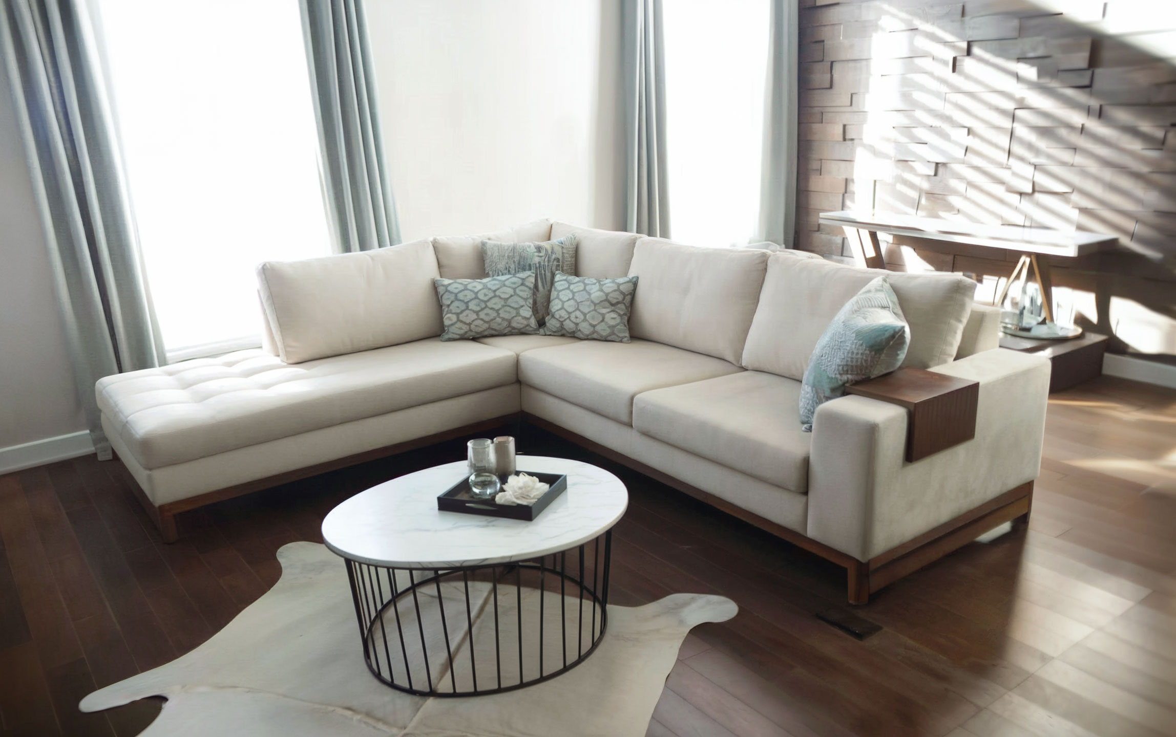 Natural lighting streams through the windows, creating long shadows on the furniture